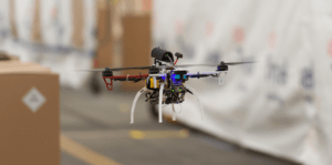 A FLA quadcopter self-navigates around boxes during initial flight data collection using only onboard sensors/software