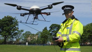 Image #: 3356832    PC Derek Charlton of Merseyside Police operates their new aerial surveillance drone in Liverpool.   PA Photos /Landov