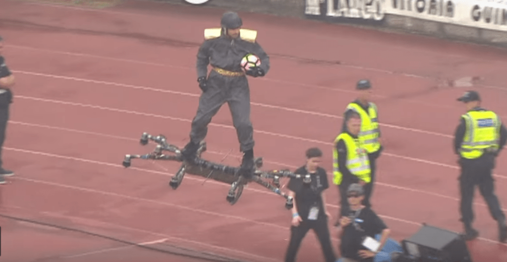 man riding drone delivers ball in portugal football final