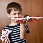 boy with quadcopter drone