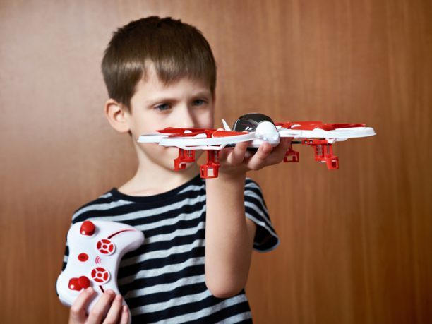 boy with quadcopter drone