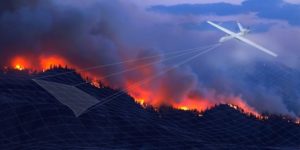 A drone flying over a wildfire