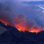 A drone flying over a wildfire