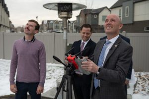 Gov. Cox far right pilots a Teal drone under the supervision of Teal Founder and CEO George Matus far left
